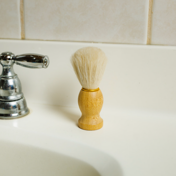 Shave brush standing on the sink