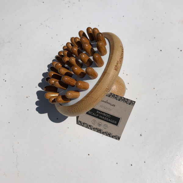 Bamboo Stimulating Scalp Massager with a label