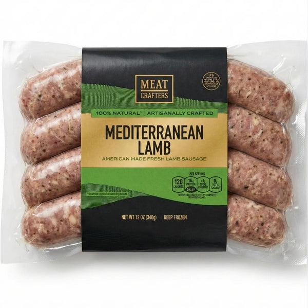 A package of Meat Crafters Mediterranean Lamb sausages in a clear plastic bag with a black and green label, showing the raw pinkish-brown sausages through the packaging.